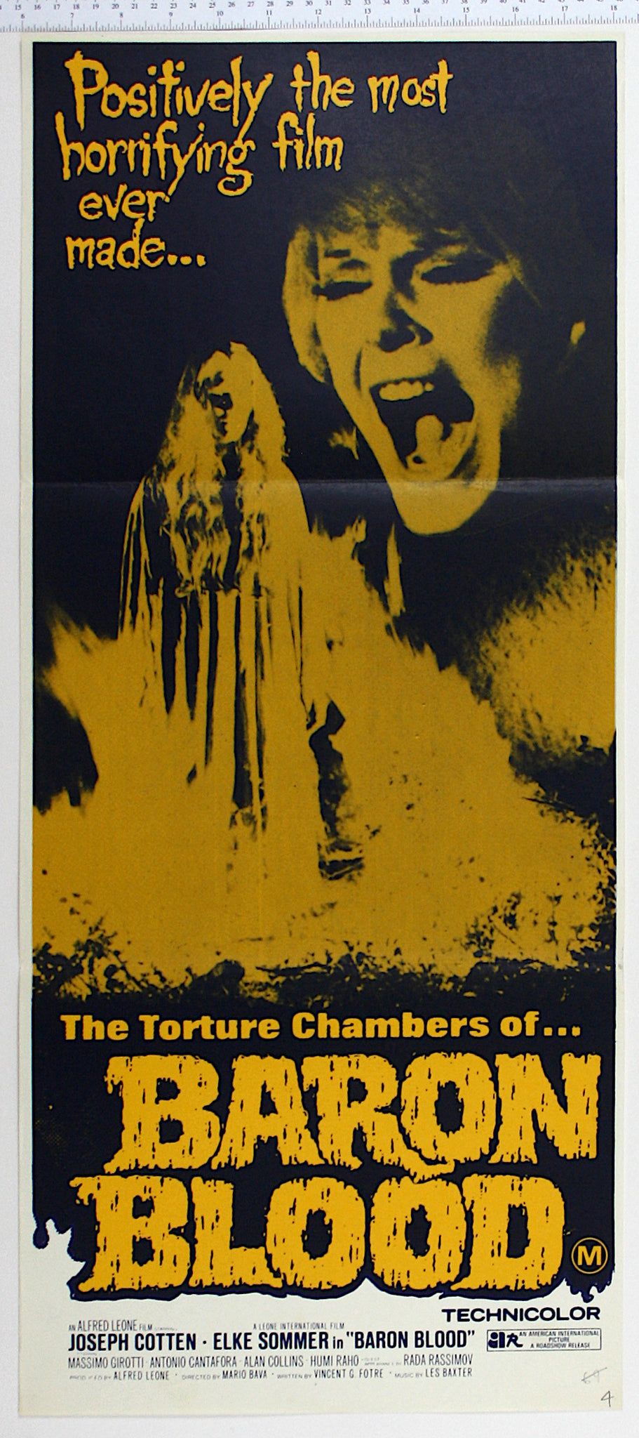 Artwork in yellow and black, with Sommer screaming in close up and spectral woman in nightgown being consumed by fire