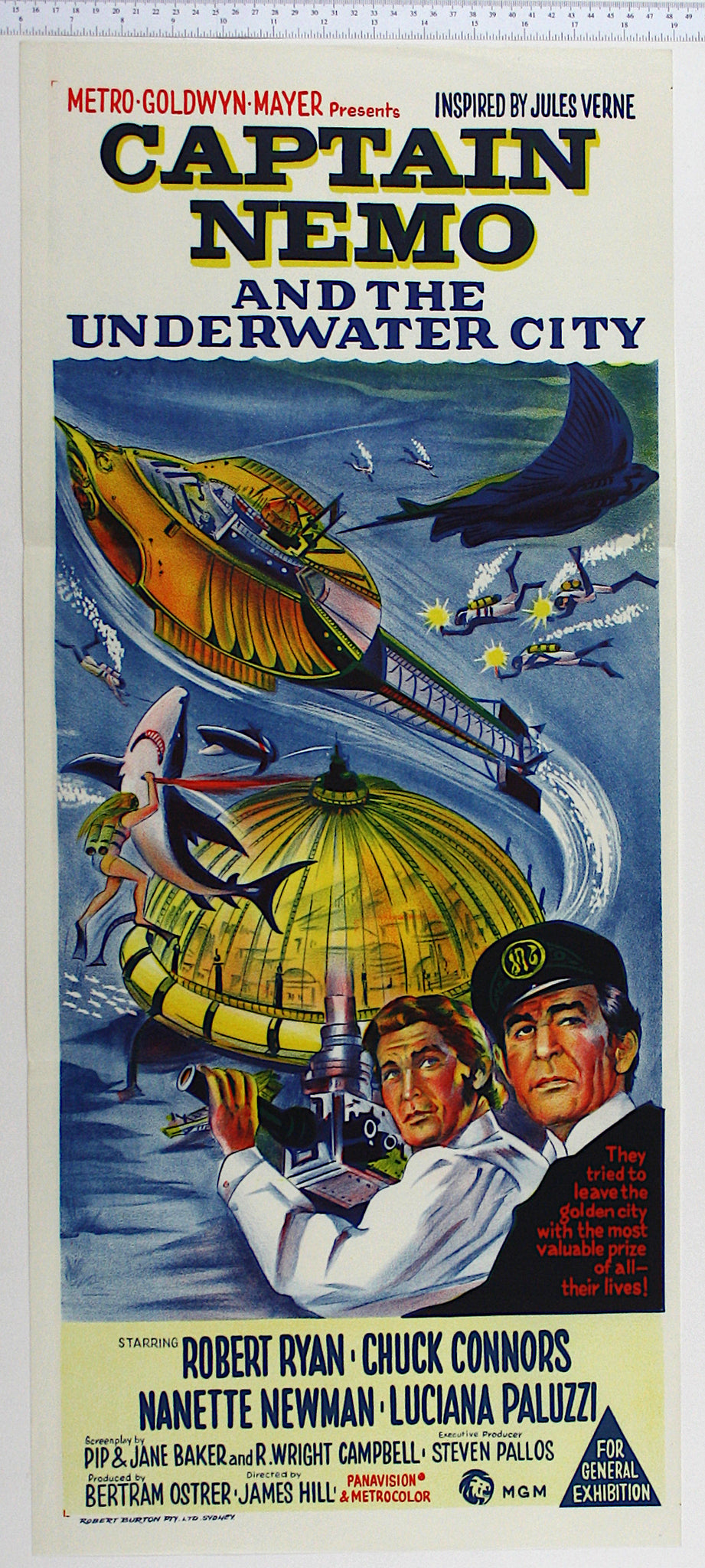 Stone litho artwork of the Nautilus, underwater city, a large ray and shark menacing divers, with Ryan and Connors bottom right.