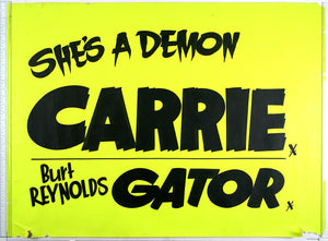 On fluorescent yellow, painted black text of Carrie with unofficial tagline, and below, Gator.