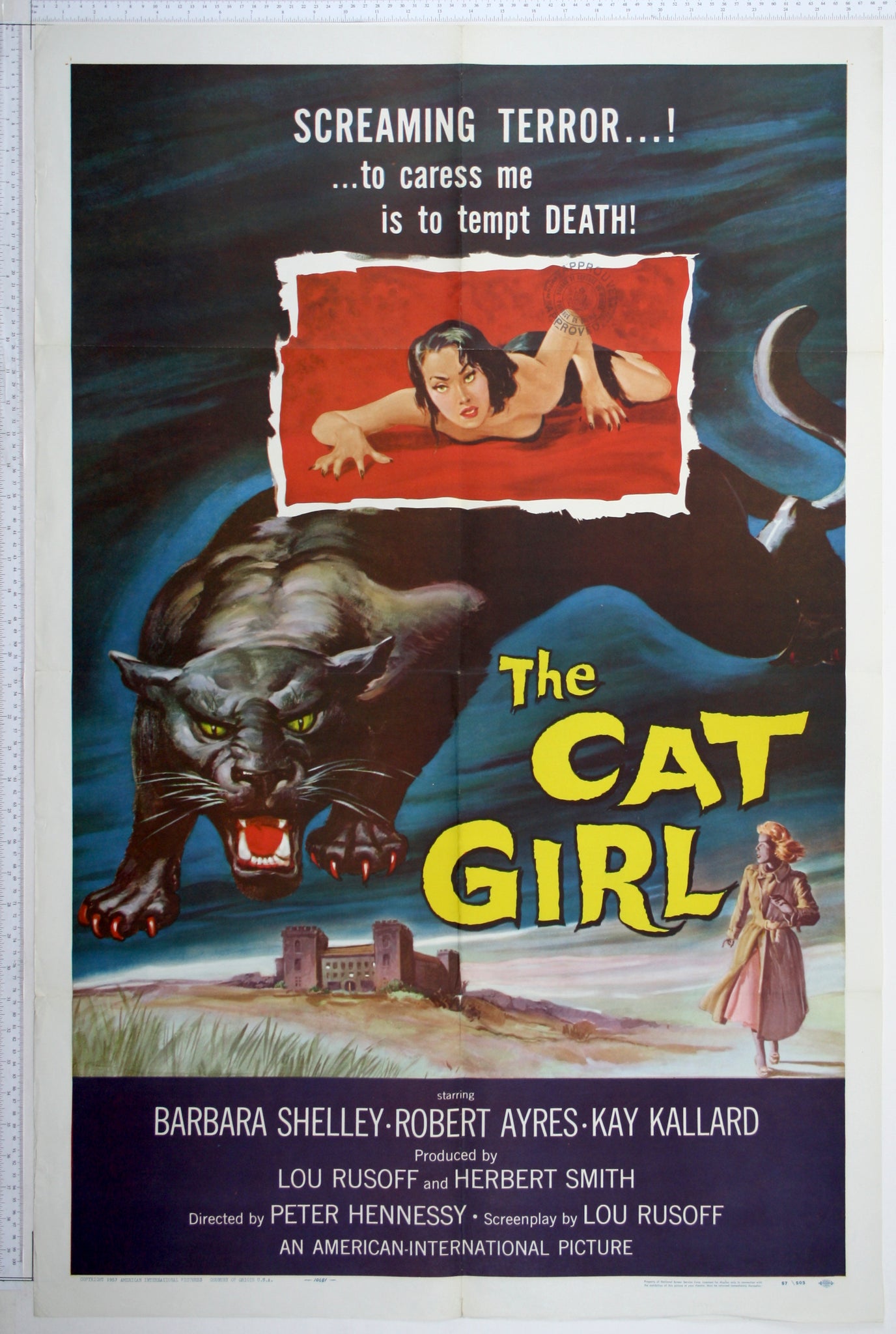 A huge snarling black panther writhes over distant, house. In inset box a near-naked woman mirrors the panther's pose.