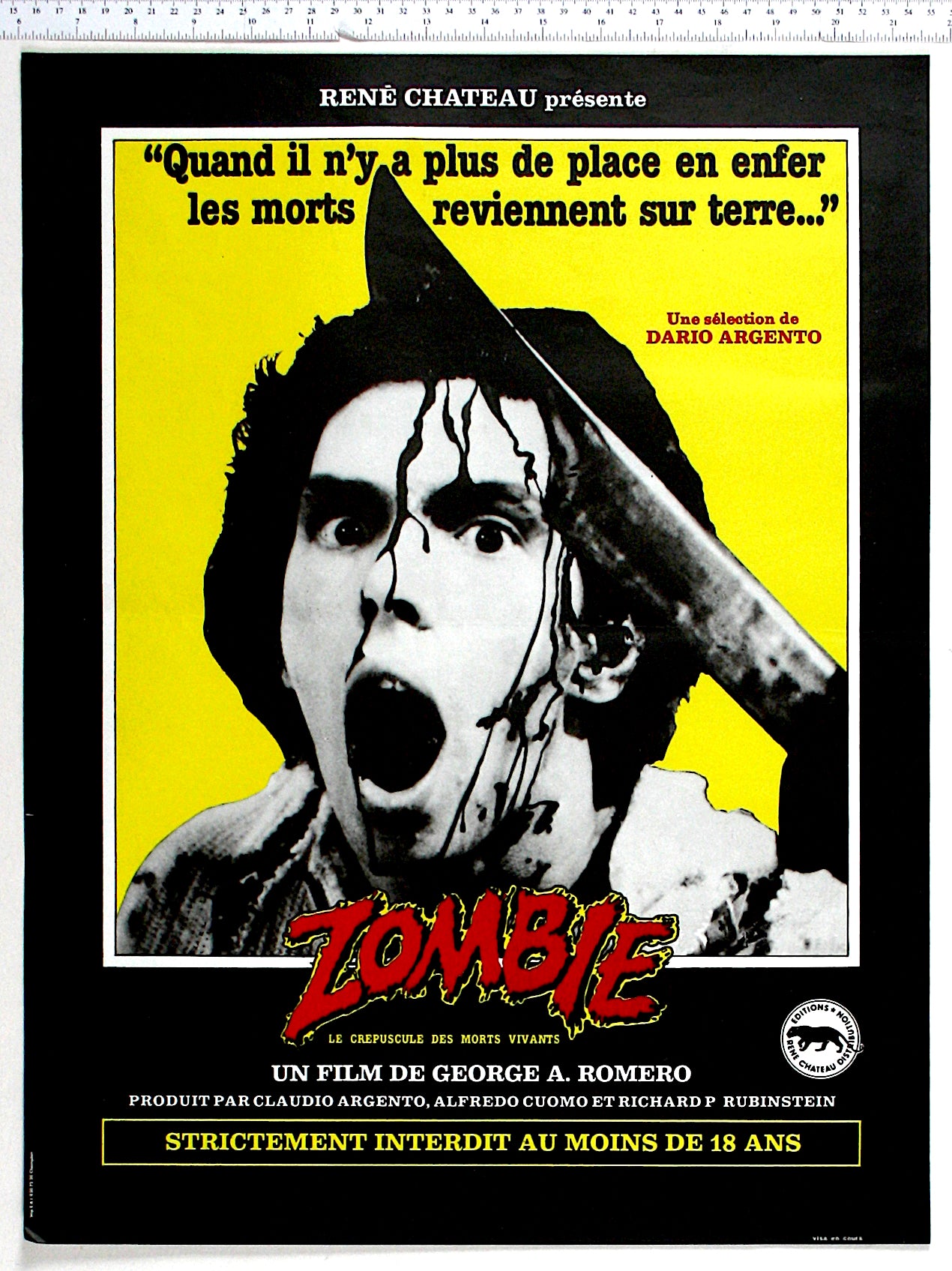 Boxed against yellow, black and white shot of the machete zombie, with the Zombie title in blood-red below.