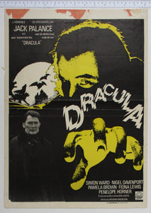 On black, yellow hand reaches forward in front of Dracula's face. At left photo of Palance, moon and howling wolves and castle.