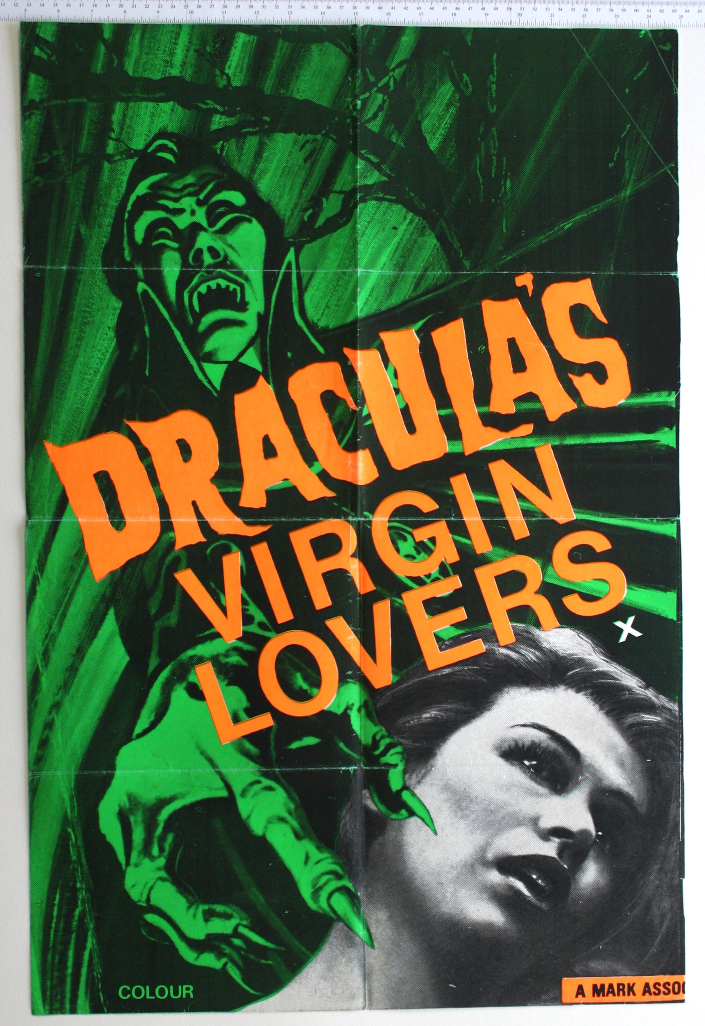 Green / black artwork of vampiren clawed hand reaching for b+w photo of female victim.