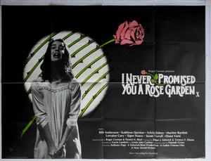 On black, Quinlan in despair, crying and screaming in front of thorned roses motif. Rose artwork within title to right.