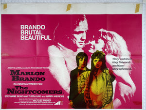 On purple, high contrast photo of naked Brando & Beacham, in front, yellow/orange photos of the children.