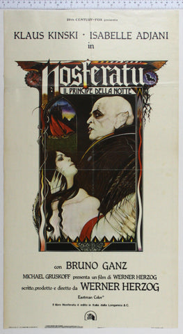 In shaped inset, artwork of bald vampire holding young dark-haired girl, through arch a boat flounders , castle behind.