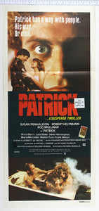 Huge staring photo of Patrick, lovers in front, below couple are electrocuted in bath.