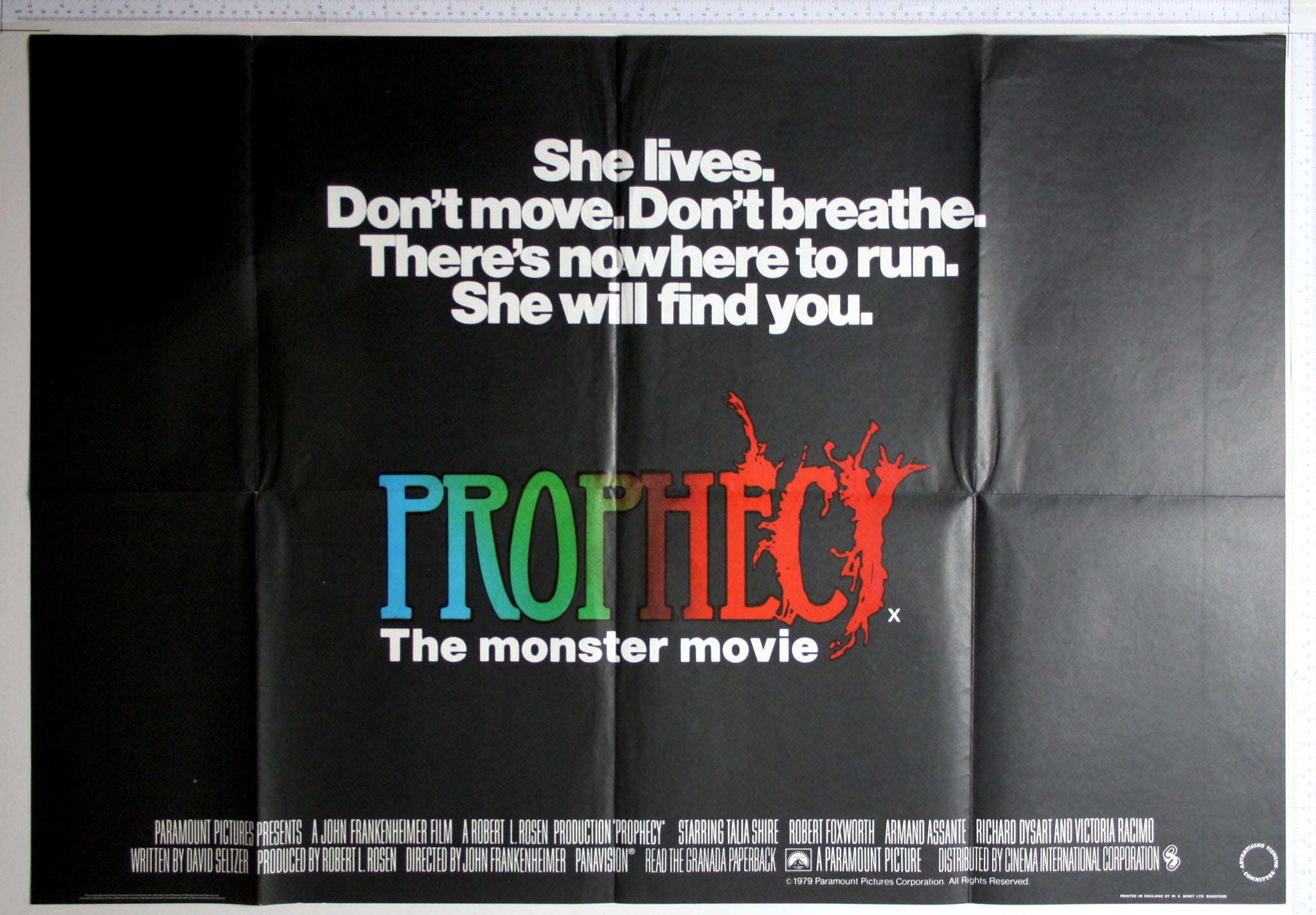 Text poster with tagline in white, and multicoloured title ending in red, the letters spreading and dissolving.