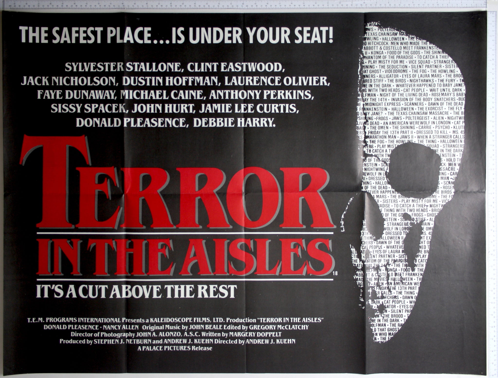 Text on black, with skull design right, white areas showing all the titles of the films included in the compilation.