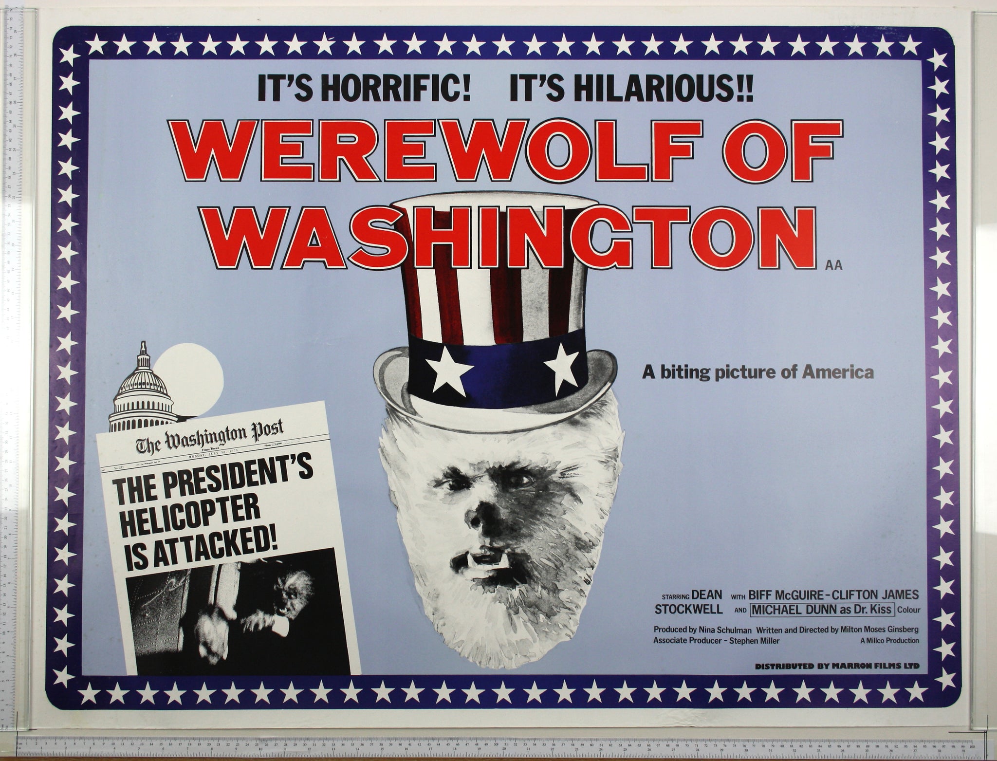 On blue, werewolf in stars and stripes top hat, with Washington Post headline and picture and Capitol at rear.