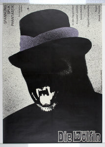 On splattered white, black silhouette of ape in hat, baring its white fangs and snarling.